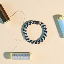 Haargummi KKNEKKI - braun meerblau glitter gestreift