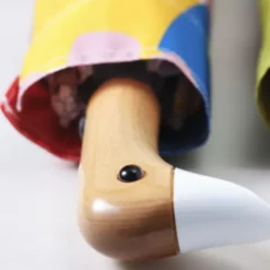 Regenschirm mit Entenkopf Griff aus Holz bunt - Original Duckhead Taschenschirm