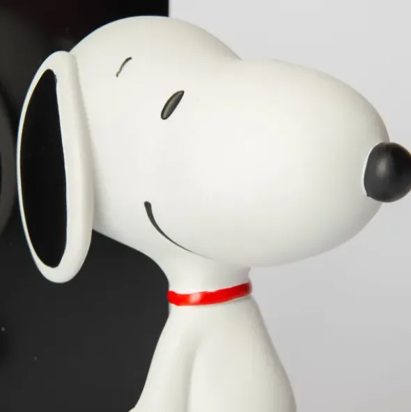 Snoopy Buchstütze – Peanuts Bücherhalter schwarz mit Snoopy Figur